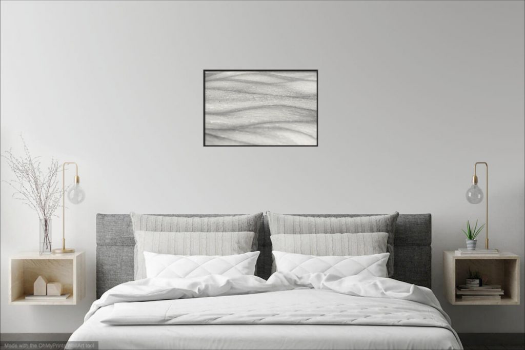 Wall art visualization in a bed room. 61 cm x 41 cm glossy finish canvas print with black wooden frame.
