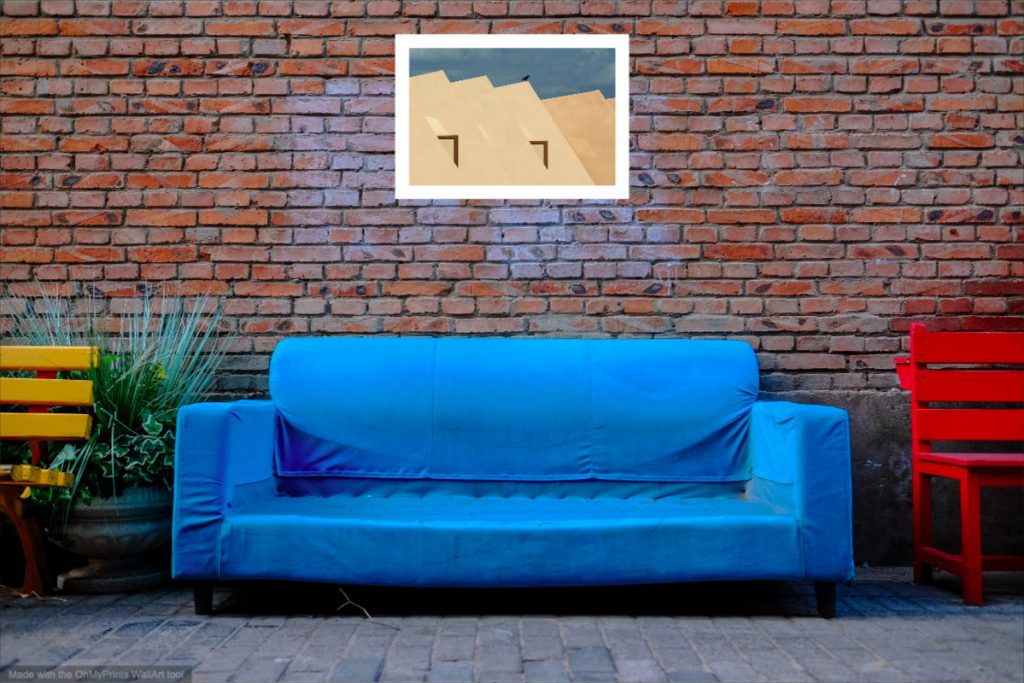 Visualization of landscape photography “Desert house in the Gobi” in the industrial style living room. Image size 76 cm x 51 cm, with a white mat but without a frame, printed on glossy photo paper.