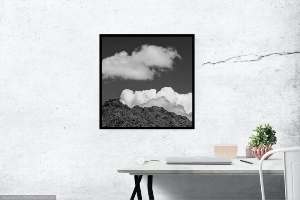 Large square black and white landscape photography print with simple wooden frame.