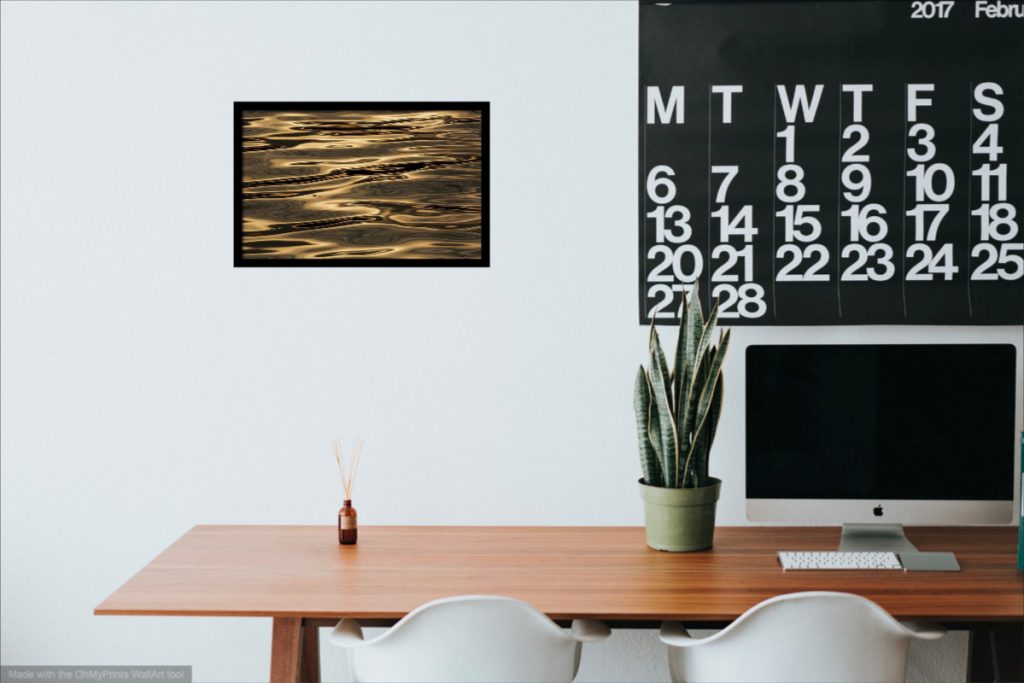 Visualization of minimalist landscape photography with simple black frame on the office wall.