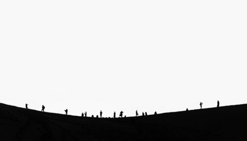 Silhouettes of people on a sand dune – Fine art photography - Art print by Martin Vorel
