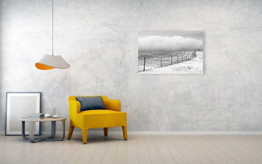 Visualization of a black and white photograph of a winter landscape printed on an acrylic plate measuring 102 x 67 cm. Suspended on the wall with metal posts.