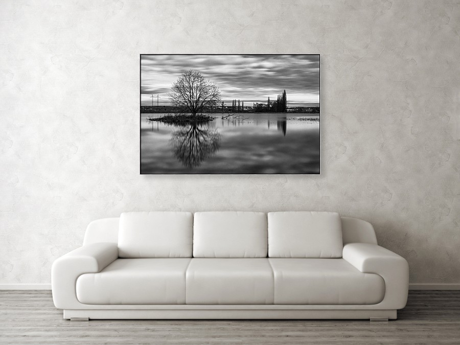 Visualization of a large black and white art photograph (122 cm x 81 cm canvas) on the wall of the living room. The photo has a black-silver aluminum frame.
