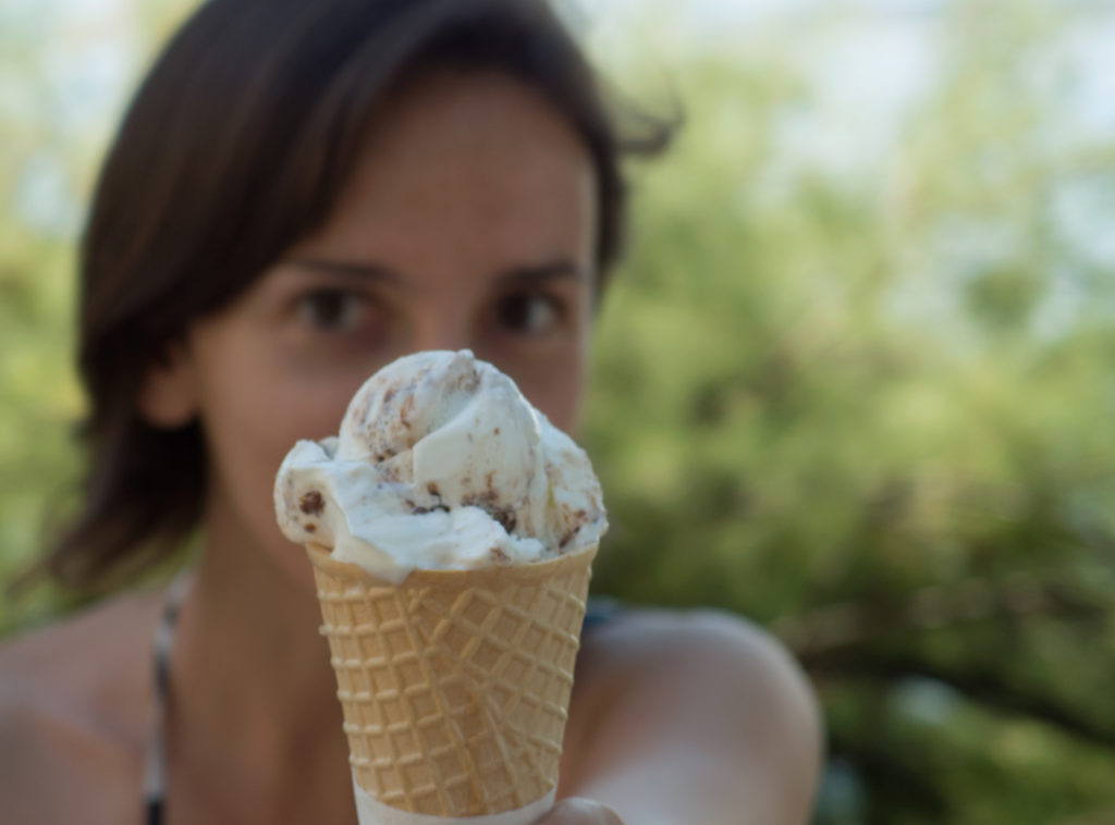 Woman with ice cream. Ice cream is also food and an interesting subject for a photo shoot.