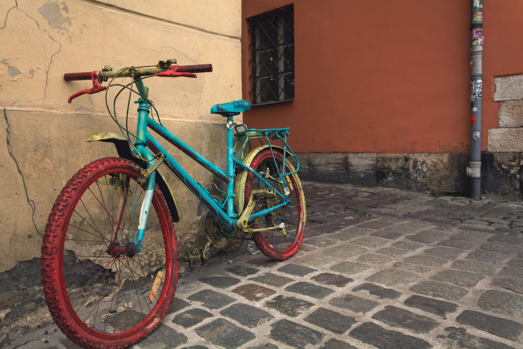 An old painted mountain bike as a decoration on the street. 