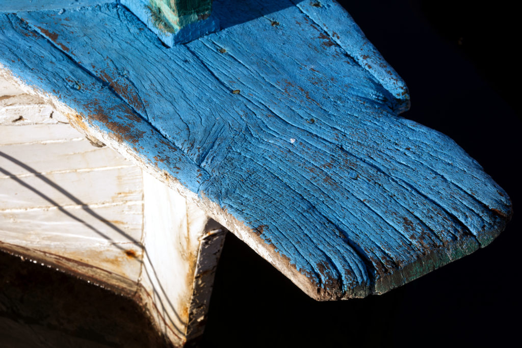 Detail of white blue wooden boat