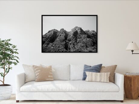 Mountain Peaks in Black and White - fine art print in a minimalist living room above a white sofa