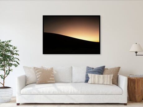 Sand Dune Silhouette in Morocco, fine art print in a minimalist living room above a white sofa - Desert